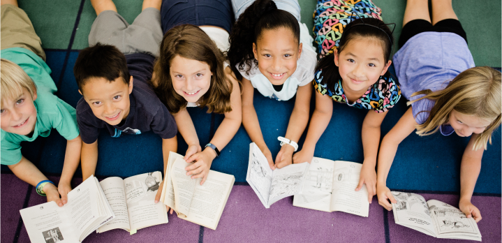 This is an image of children with books.